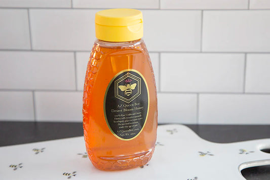 Raw local honey. AZ Queen Bee Desert Bloom 16 oz squeeze bottle.
