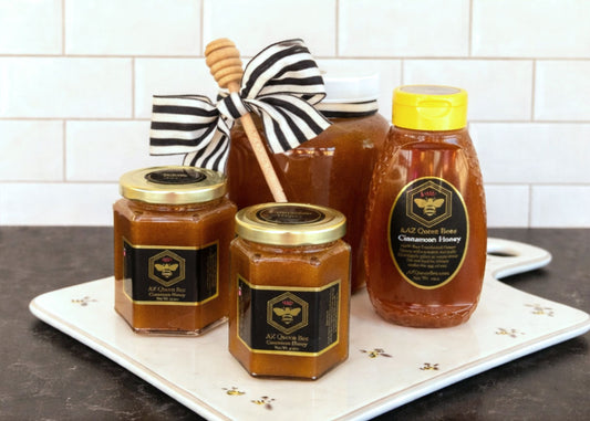 Cinnamon infused honey from AZ Queen Bee. Available in half gallon, Squeeze bottle, and small hex jars